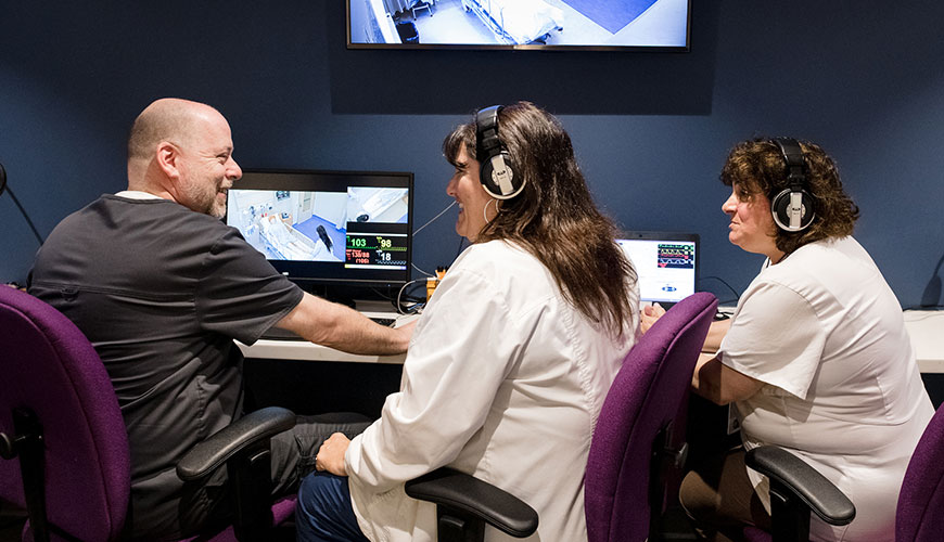 Christen Rose in front of a classroom